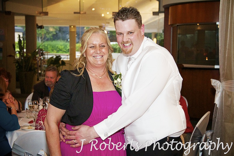 Groom hugging Mum at wedding reception - wedding photography sydney